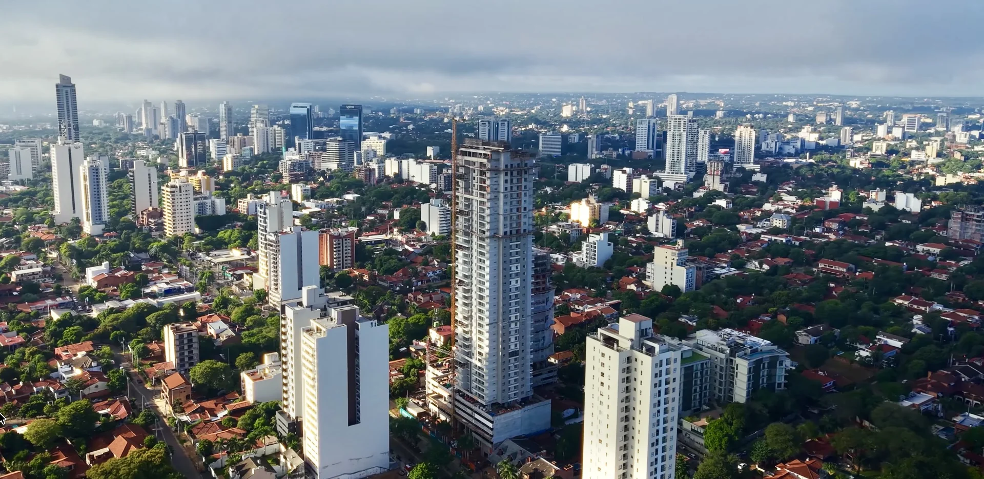 Aerial view of residential buildings and green neighbourhoods in Asunción